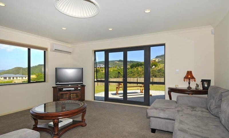 living room with lots of light and door leading to patio