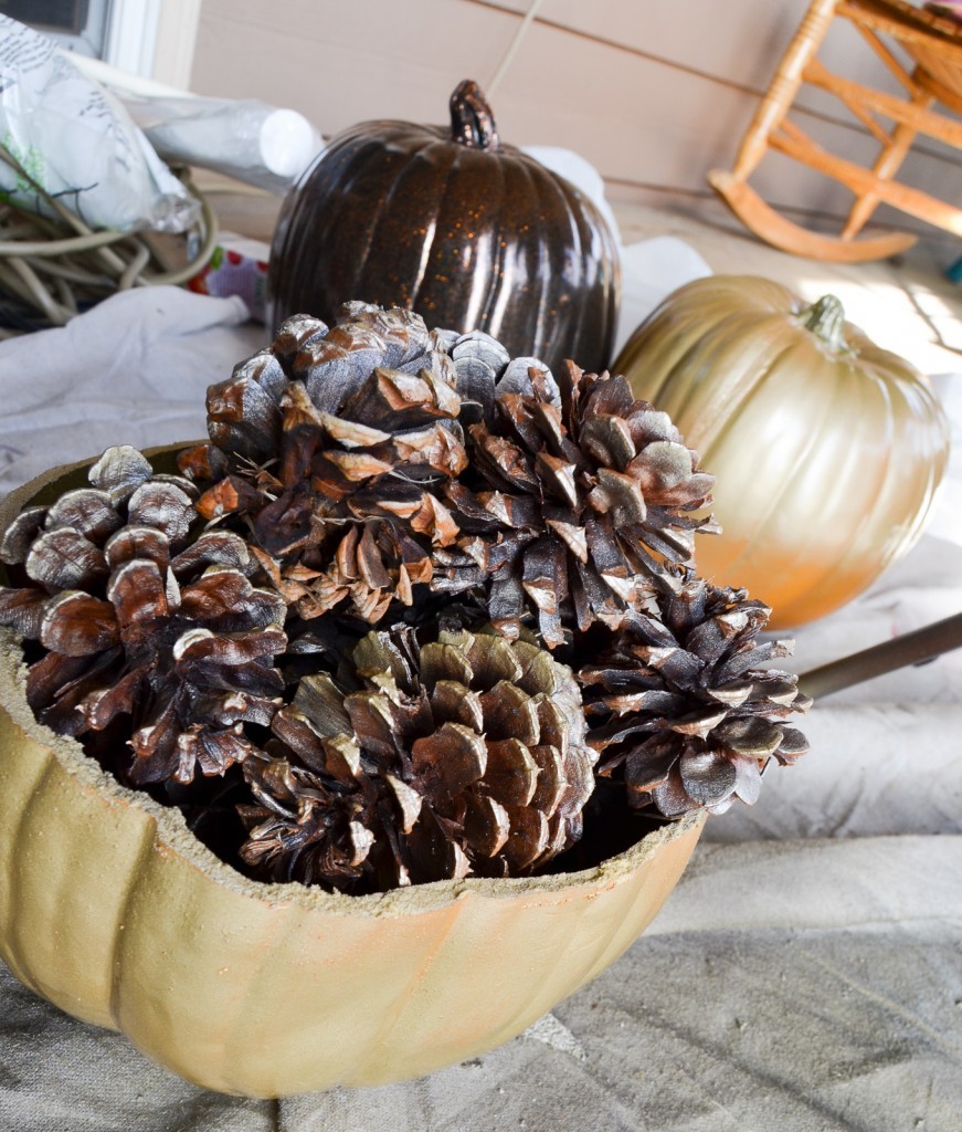 gold pumpkin and pinecones