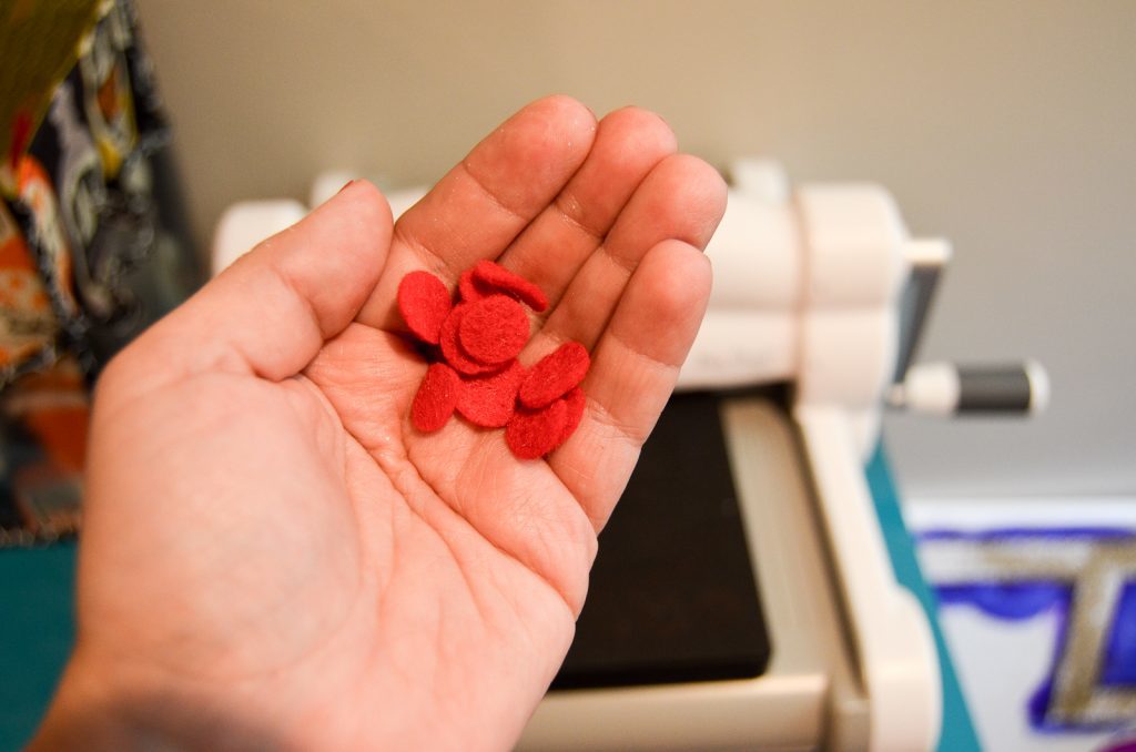 a handful of felt cherries