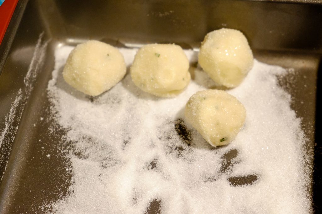 roll dough in sugar