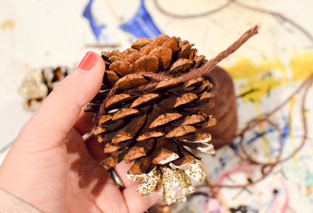 tie twine around the pinecones